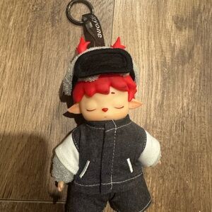 Adorable Plush Toy with Red Hair and Black Outfit